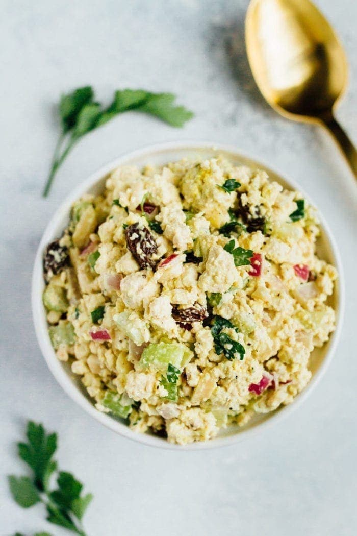 A serving of vegan chicken salad in a white bowl.