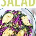 Salad with kale, cabbage, avocado, broccoli, chickpeas, and a nutritional yeast goddess dressing in a bowl.