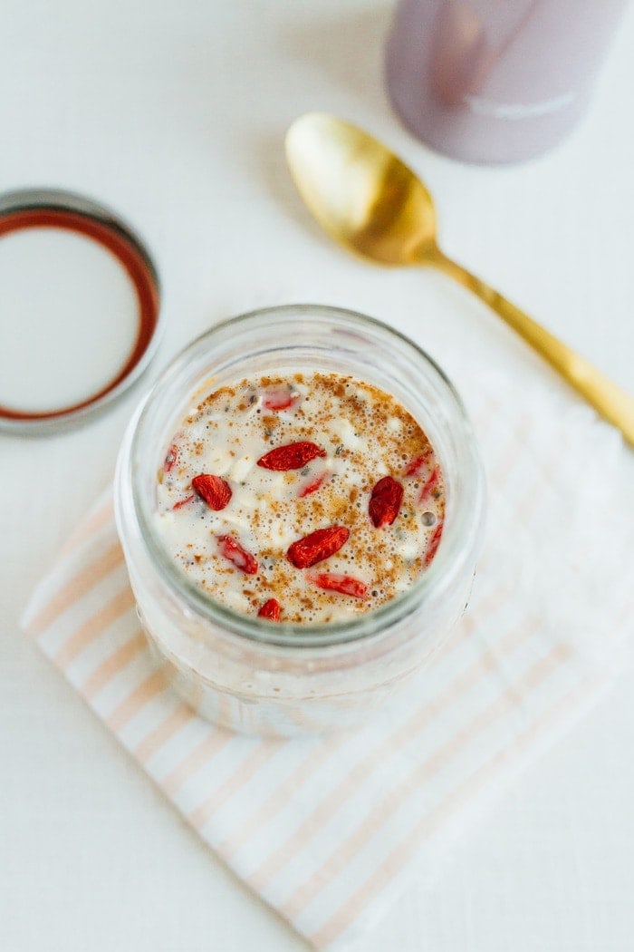 Cereal lovers rejoice! This healthy superfood cereal is loaded with nutrient-dense foods, plus it's gluten free, has no added sugars and packs a nice punch of omega-3s and protein. Put the cereal in a mason jar for easy transport when you need a quick on-the-go breakfast! A mason jar with milk, oats, and goji berries.
