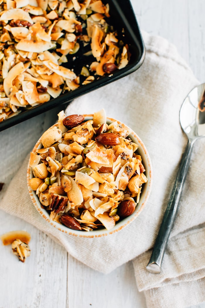 Overhead photo of a bowl with 5-Ingredient Grain Free Granola and a silver spoon.