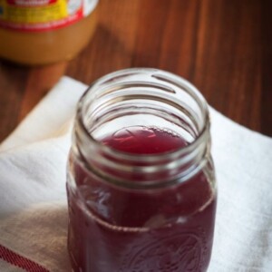 ACV and grape antioxidant drink served in a mason jar.