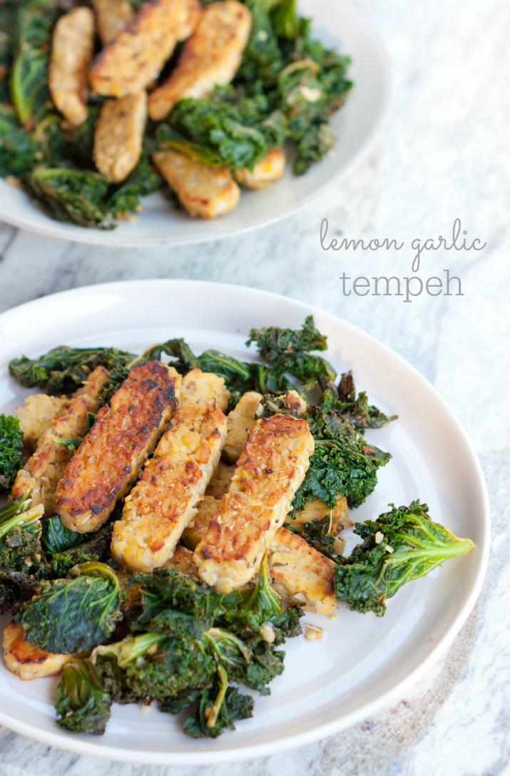 PIN THIS--> Lemon Garlic Tempeh Lemon garlic tempeh slices over a bed of cooked kale.