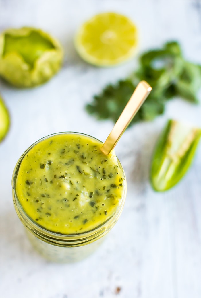 PIN THIS --> Chopt Mexican Goddess Dressing Recipe Chopt Mexican Goddess with tomatillos and avocado in a mason jar with a gold spoon.