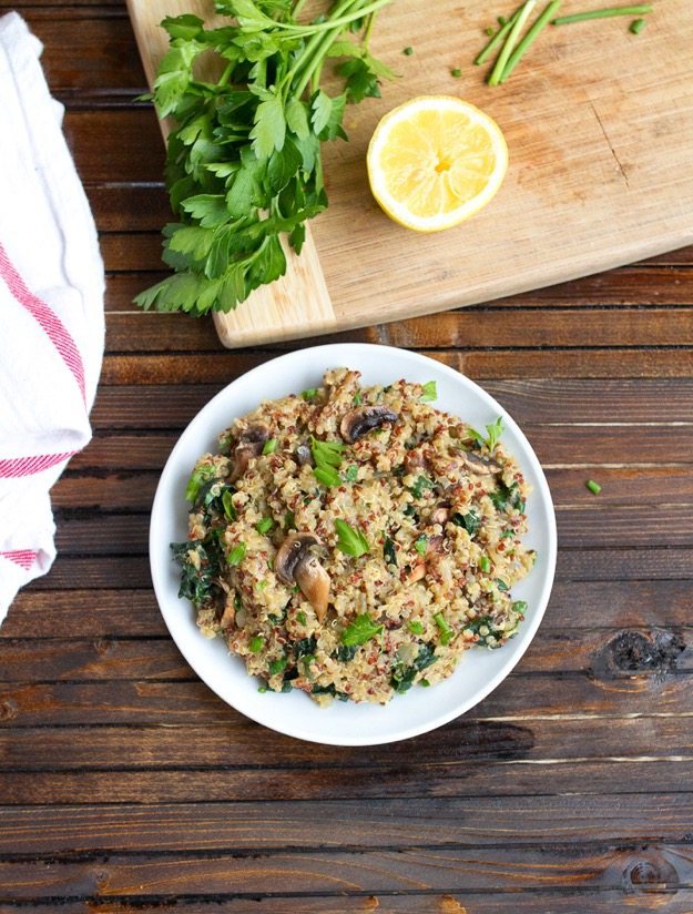 Mushroom Kale Quinoa Risotto Mushroom kale quinoa risotto served on a white plate.