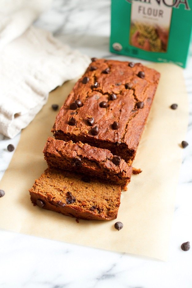 Spiced with cinnamon, nutmeg, ginger and allspice this moist and tender chocolate chip pumpkin bread is everything a pumpkin quick bread should be but a tad healthier, gluten-free and vegan. Sliced loaf of quinoa flour pumpkin bread on a piece of parchment paper.