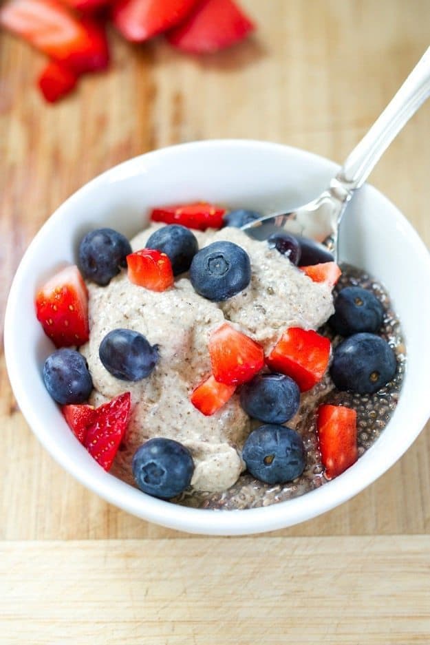 Eating Clean Creamy Breakfast Chia Pudding A bowl of creamy cashew chia pudding with a spoon resting in the bowl.