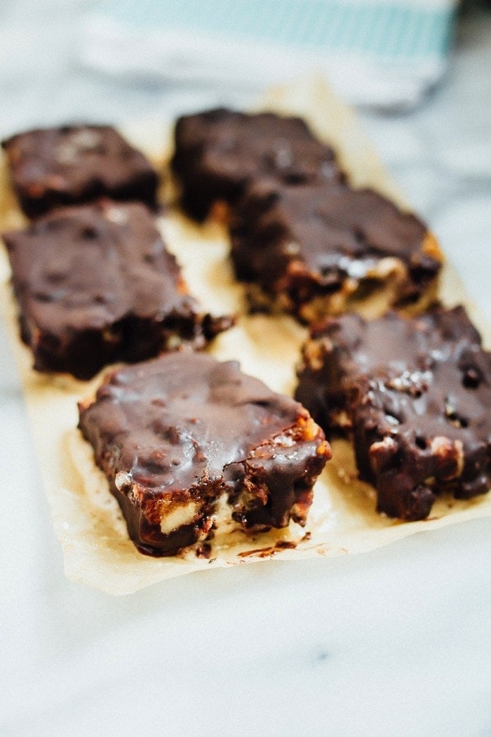 Pin this image to save these healthy Chocolate Caramel Banana Ice Cream Bars! Chocolate Caramel Banana Ice Cream Bars on parchment paper.