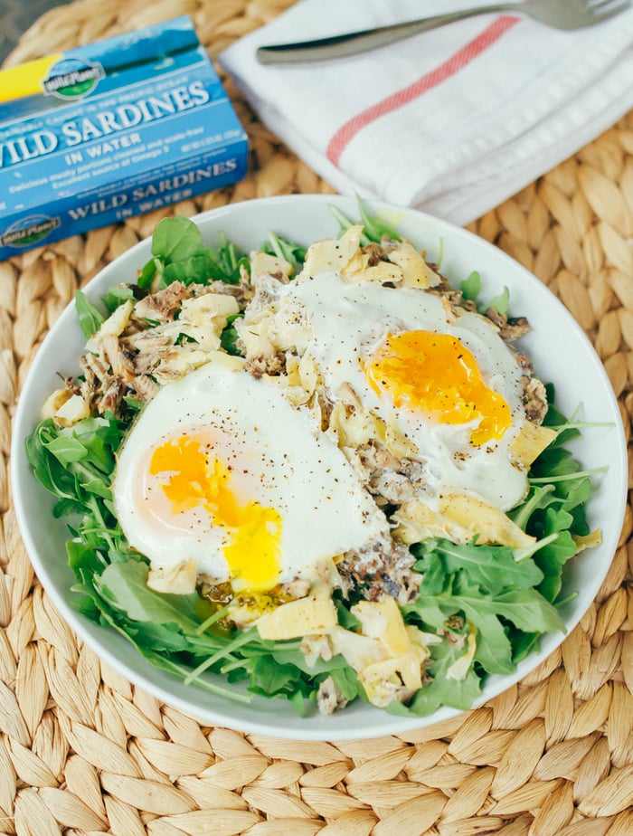 Seaside Breakfast Salad -- A quick and simple low-carb paleo breakfast recipe with sardines, artichokes and eggs, baked and served over fresh arugula. Seaside Breakfast Salad -- A quick and simple low-carb paleo breakfast recipe with sardines, artichokes and eggs, baked and served over fresh arugula.