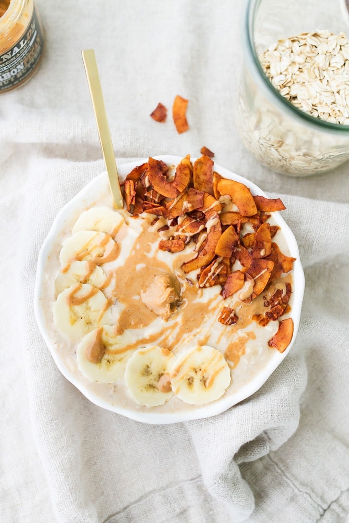 Elvis Overnight Oats with Peanut Butter, Banana and Coconut Bacon #vegan #glutenfree Peanut butter banana and. bacon overnight oats served in a white bowl.