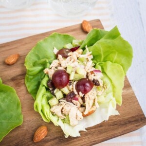 Almond butter chicken salad made with almonds, celery and grapes in lettuce cups.