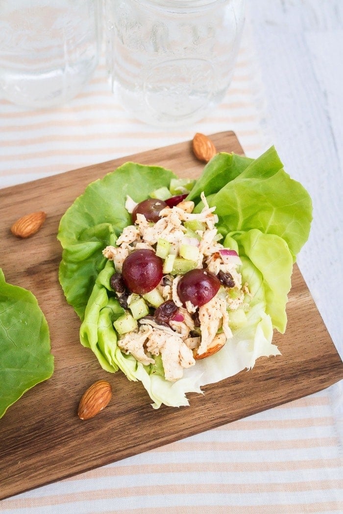 Almond Butter Chicken Salad -- perfect for serving in lettuce wraps or on your favorite sandwich bread. Almond butter chicken salad made with almonds, celery and grapes in lettuce cups.