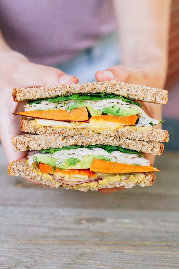 Healthy Sweet Autumn Turkey Sandwich packed with crispy apple slices, roasted sweet potato, red onion, avocado and a honey mustard hummus spread. Healthy Sweet Autumn Turkey Sandwich packed with crispy apple slices, roasted sweet potato, red onion, avocado and a honey mustard hummus spread.
