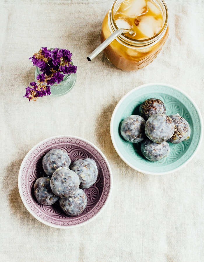 No Bake Blueberry Muffin Donut Holes // vegan and gluten-free Two bowls filled with no bake blueberry muffin donut holes.
