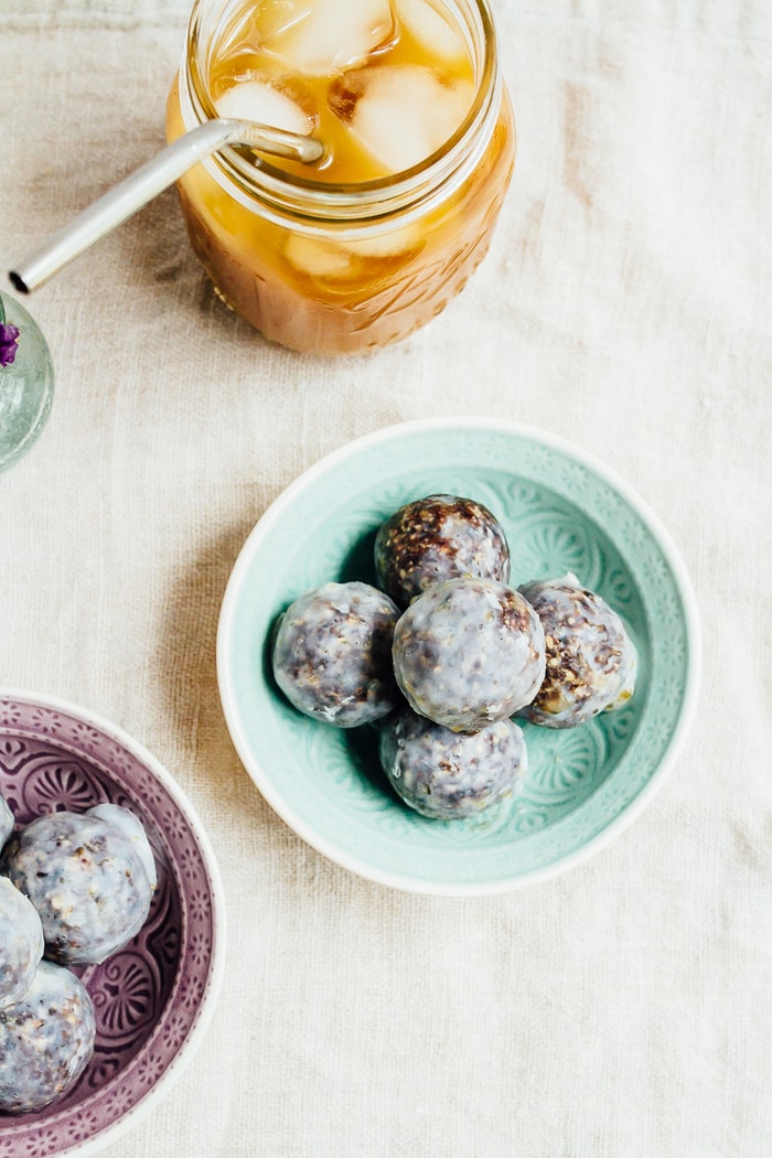 No Bake Blueberry Muffin Donut Holes // vegan and gluten-free No bake blueberry muffin donut holes served in a small teal bowl.