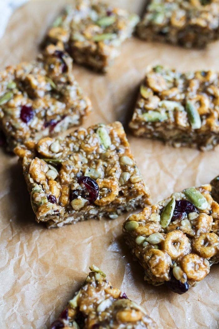 These DELICIOUS Pumpkin Spice Cereal Squares are a fall spin on my original recipe for superfood cereal squares. They’re loaded with good for you ingredients and full of pumpkin spice flavor. Gluten and dairy-free! Pumpkin spice cereal squares on parchment paper.