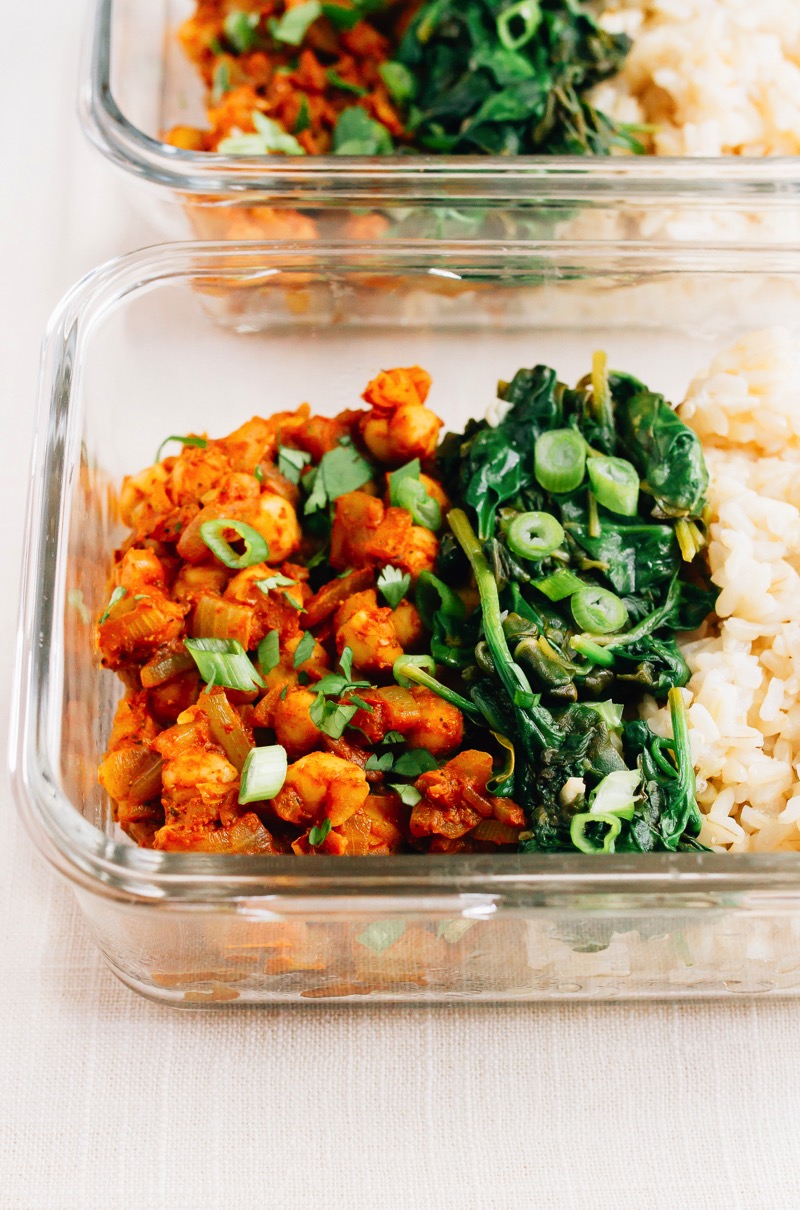 Curried Chickpea Meal Prep Bowls -- the BEST vegan meal prep recipe Curried chickpea meal prep bowls in a glass container.