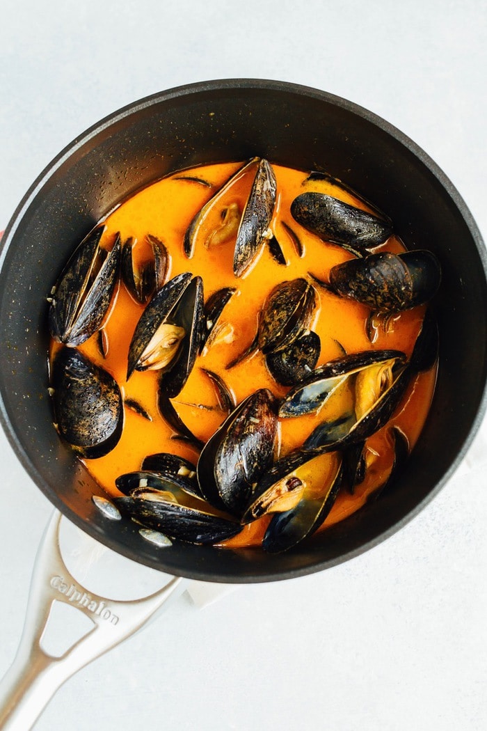 Cooking Coconut Curry Mussels Cooking Coconut Curry Mussels in a pot.