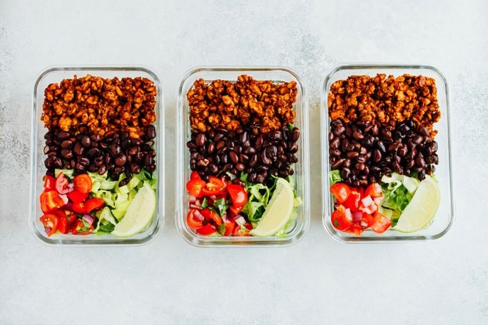 Tempeh Taco Salad Meal Prep Bowls with tempeh taco meat, black beans, tomatoes, onions and avocado Tempeh taco salad meal prep bowls with tempeh taco meat, black beans, tomatoes, onions and avocado.