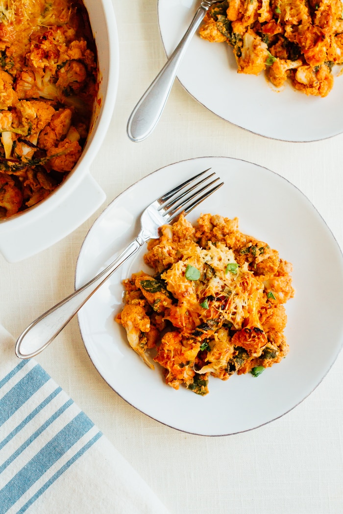 This turkey cauliflower baked ziti uses cauliflower instead of pasta noodles so it's low-carb and gluten-free while still being cheesy and delicious. Healthy low carb turkey cauliflower baked ziti on a plate with a fork.