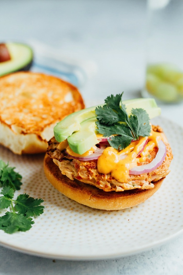 Teriyaki Salmon Burgers with Sriracha Mayo, Avocado, Red Onion and Cilantro. Teriyaki Salmon Burgers with Sriracha Mayo, Avocado, Red Onion and Cilantro.