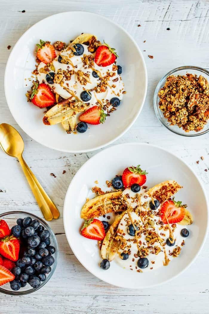 VEGAN Banana split Breakfast Bowl with Dairy-Free Yogurt, Caramelized Bananas, Berries and Grain-Free Granola VEGAN Banana split Breakfast Bowl with Dairy-Free Yogurt, Caramelized Bananas, Berries and Grain-Free Granola