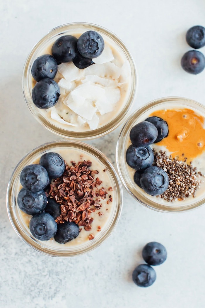 Overhead shot of three pint size mason jars with grain-free overnight "oats" Overhead photo of three pint size mason jars with grain-free overnight "oats"