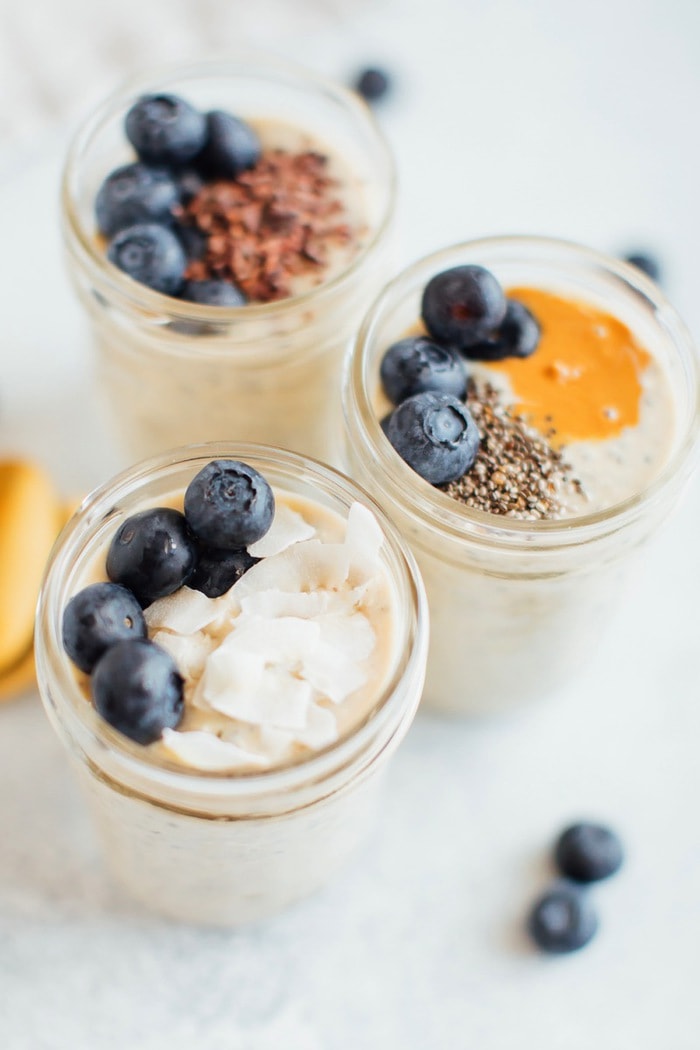 Up close shot of grain-free overnight "oats" topped with coconut flakes and blueberries. Up close photo of grain-free overnight "oats" topped with coconut flakes and blueberries.