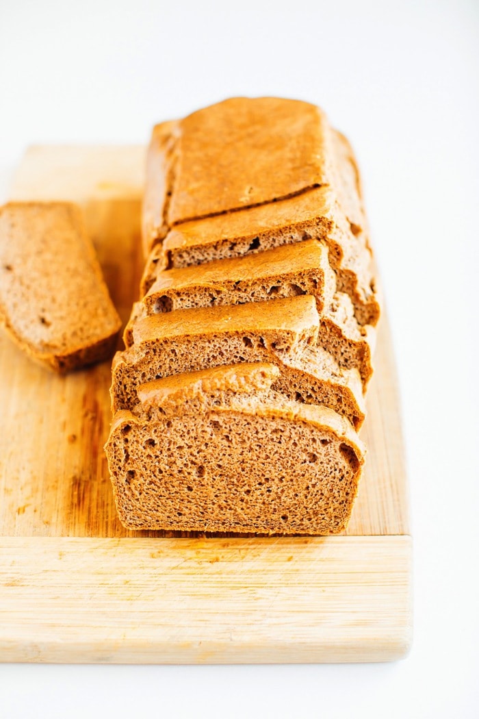 Paleo bread made with almond butter on a cutting board Paleo bread made with almond butter on a cutting board