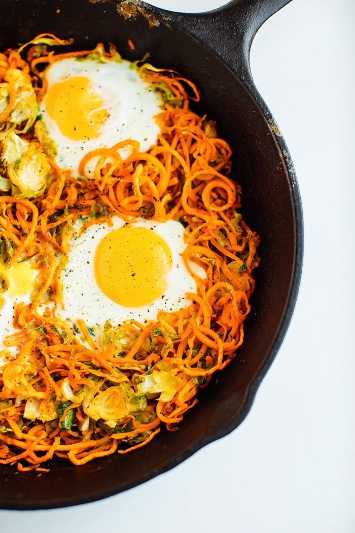 Sweet potato brussels sprout hash in a cast-iron skillet Sweet potato brussels sprout hash in a cast-iron skillet