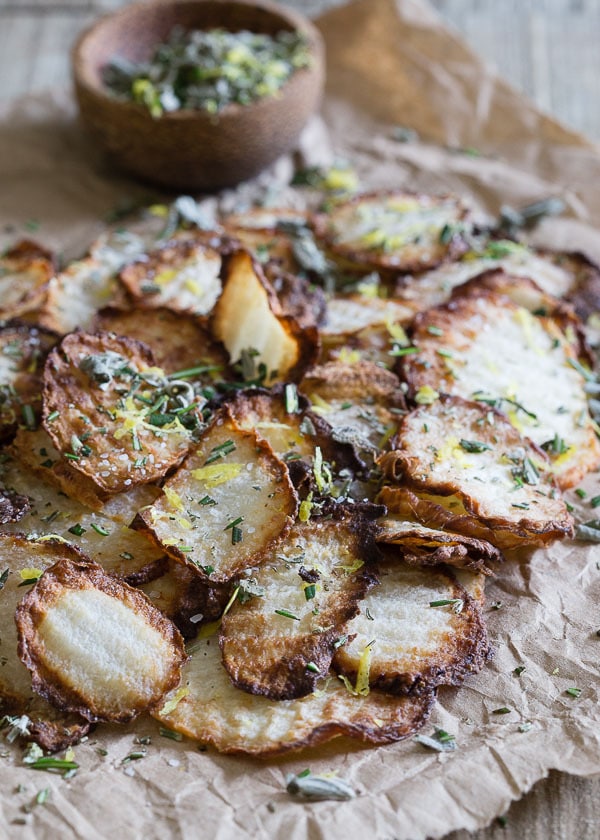 PIN THIS--> 12 Healthy Jicama Recipes Crispy jicama baked chips on parchment paper and sprinkled with salt and herbs.