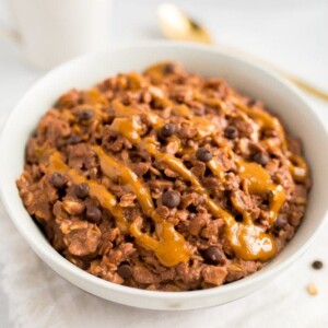Chocolate peanut butter oatmeal served in a white bowl.