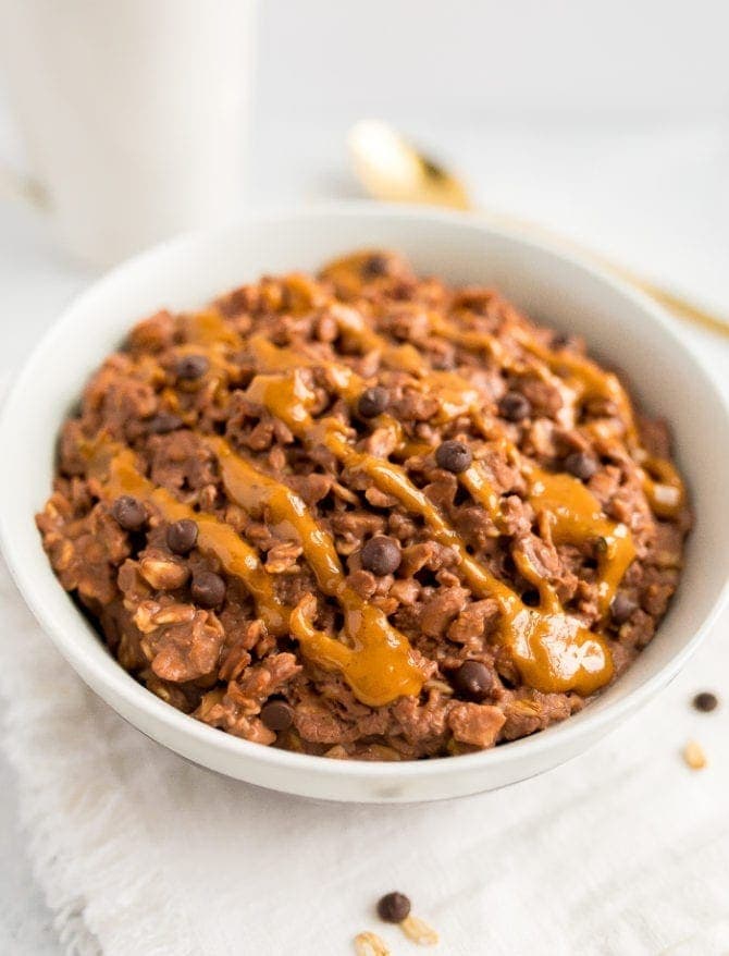 Chocolate peanut butter oatmeal served in a white bowl.