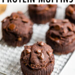 Double chocolate protein muffins on a cooling rack.