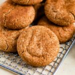 Healthy snickerdoodle cookies on a gold cookie tray.