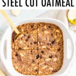 Apple cinnamon baked steel cut oatmeal in white baking dish with a gold spoon.