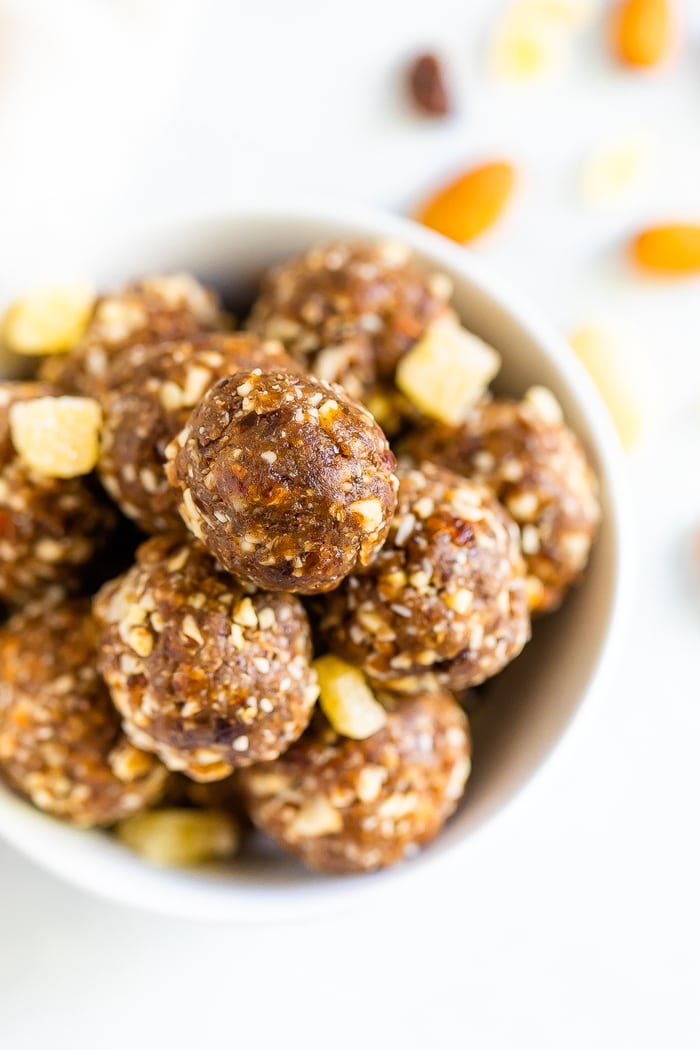 Overhead photo of white bowl with gingerbread energy balls.