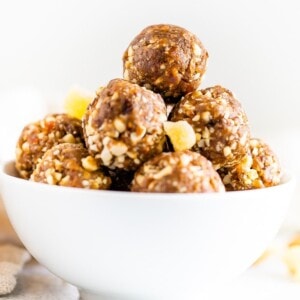 Gingerbread energy balls in a white bowl.