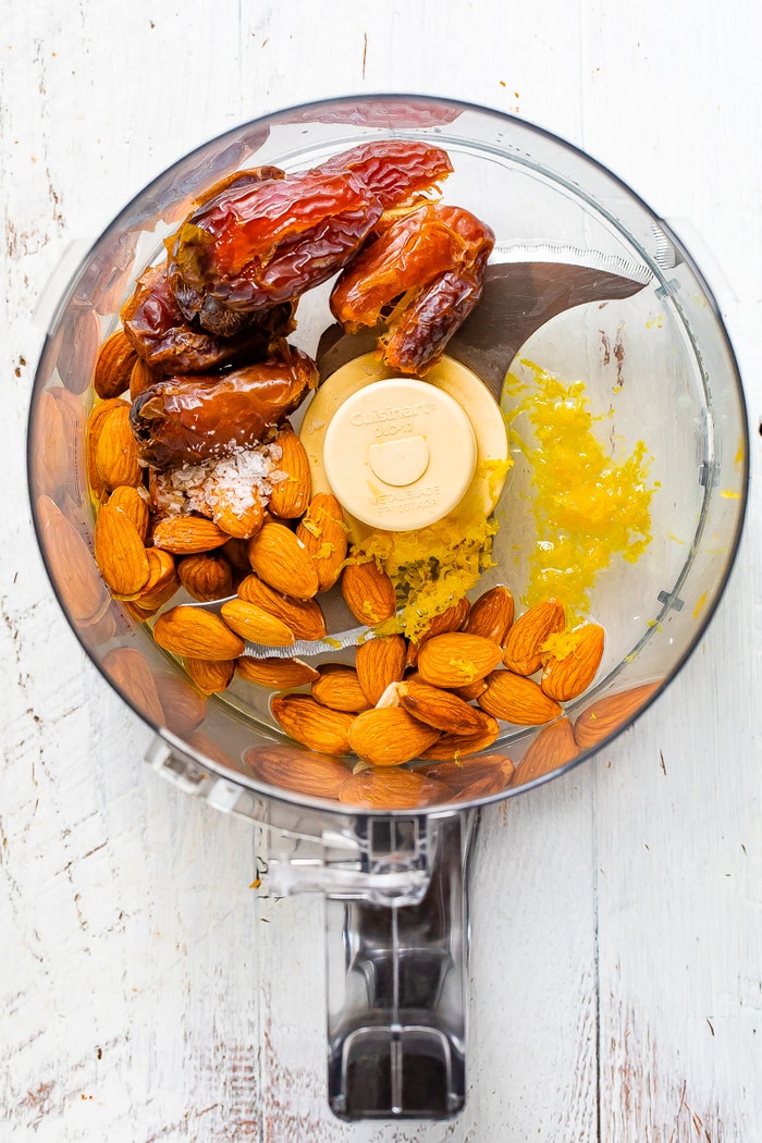 Food processor with dates, almonds, salt and lemon.
