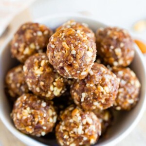 Pumpkin pie energy balls served in a white bowl.
