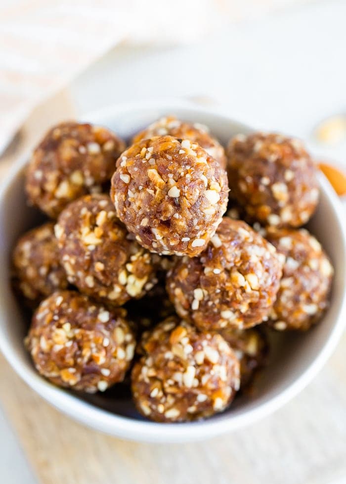 Pumpkin pie energy balls served in a white bowl.