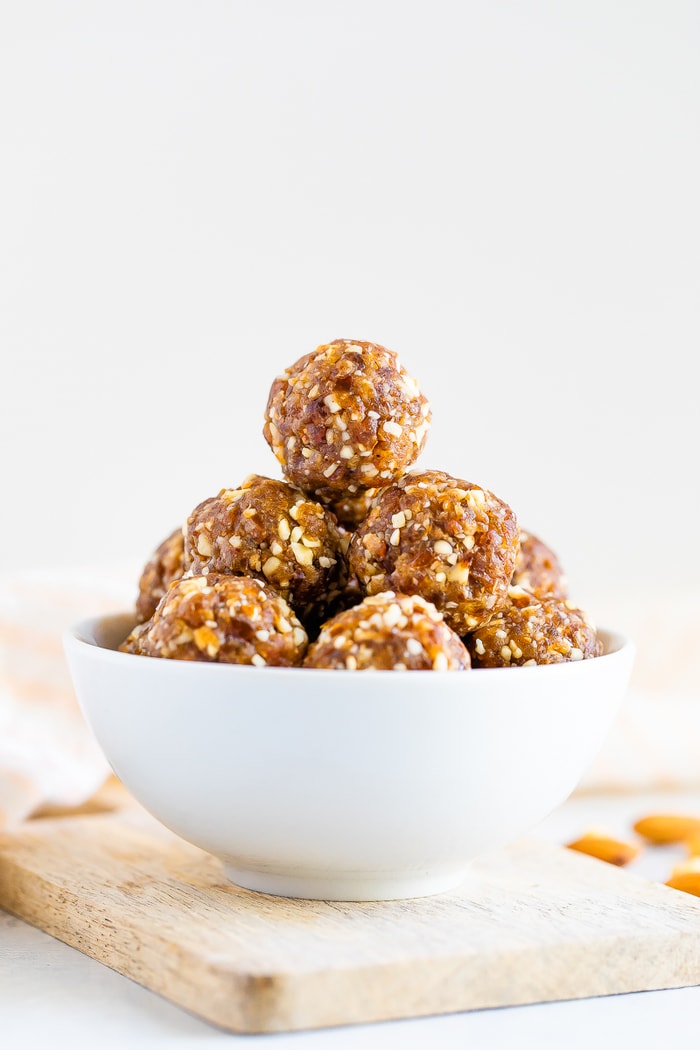 Pumpkin pie energy balls in a white bowl.