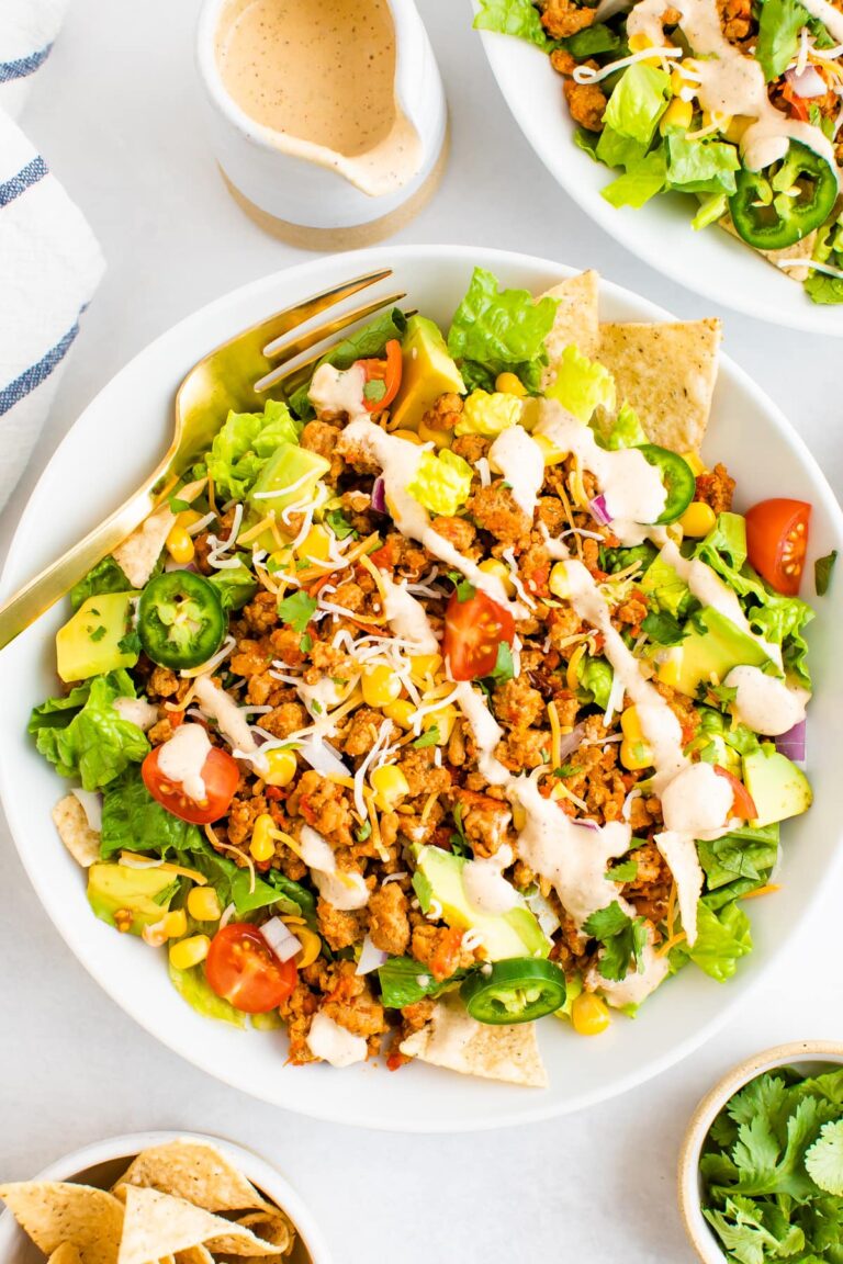 This healthy taco salad is made with ground turkey taco meat instead of beef and is packed with veggies. It comes together quickly making it perfect for a weeknight meal.