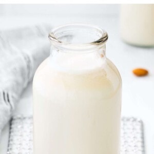 Glass bottle of homemade almond milk.