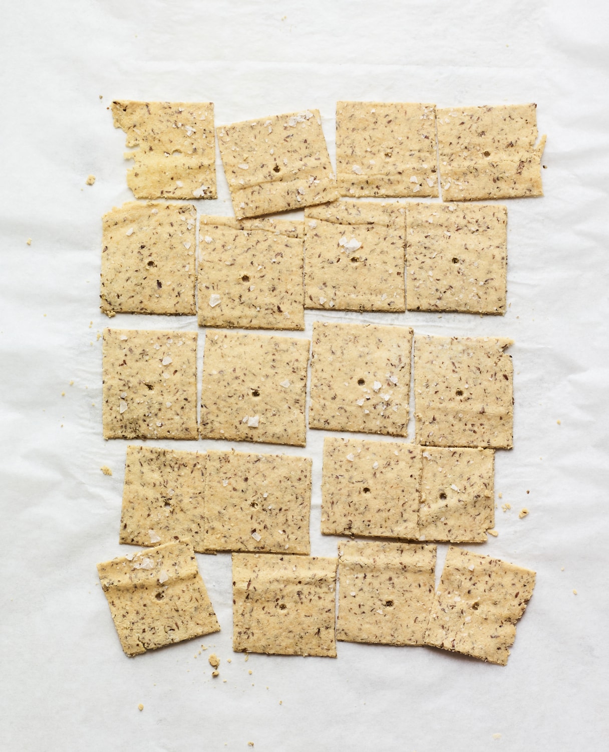 Almond crackers on parchment paper.