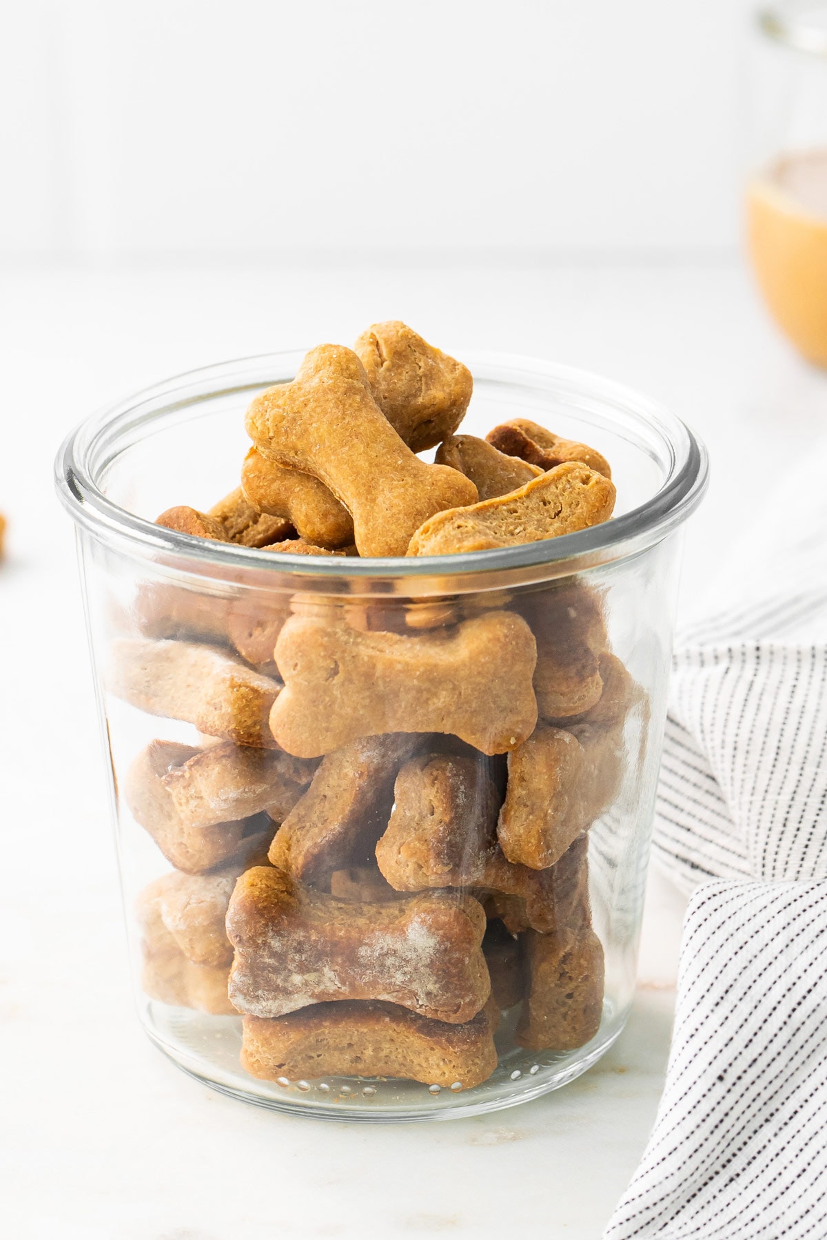 Jar of bone-shaped homemade dog treats.