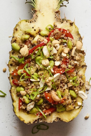 Pineapple boat full of pineapple fried quinoa.