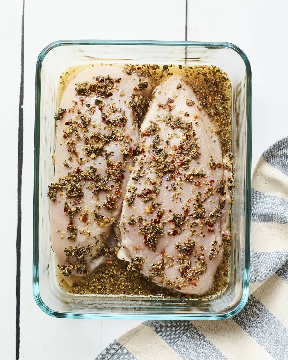 Apple Cider Vinegar Chicken Two chicken breast being marinated in a vinegar mixture.