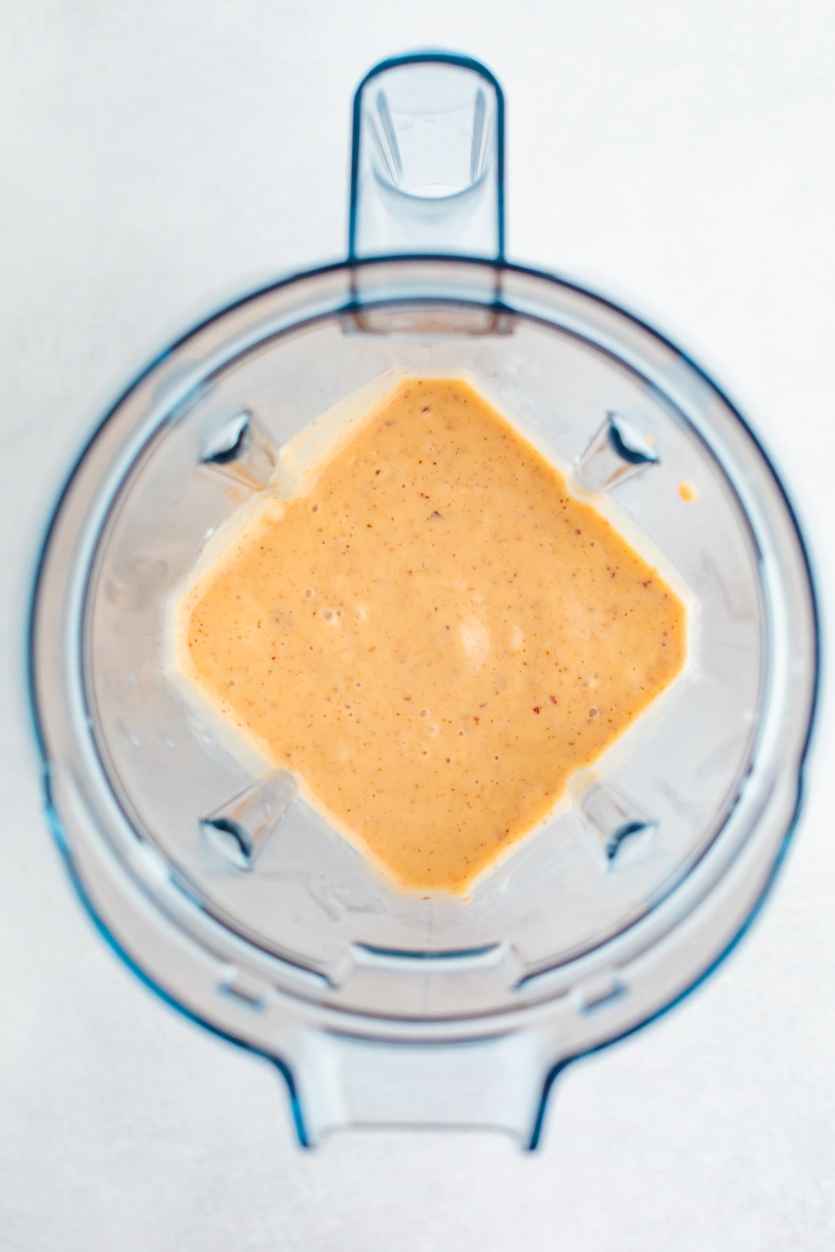 Blender with peach smoothie.