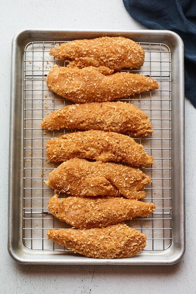 Overhead photo of chicken tenders on a baking sheet.