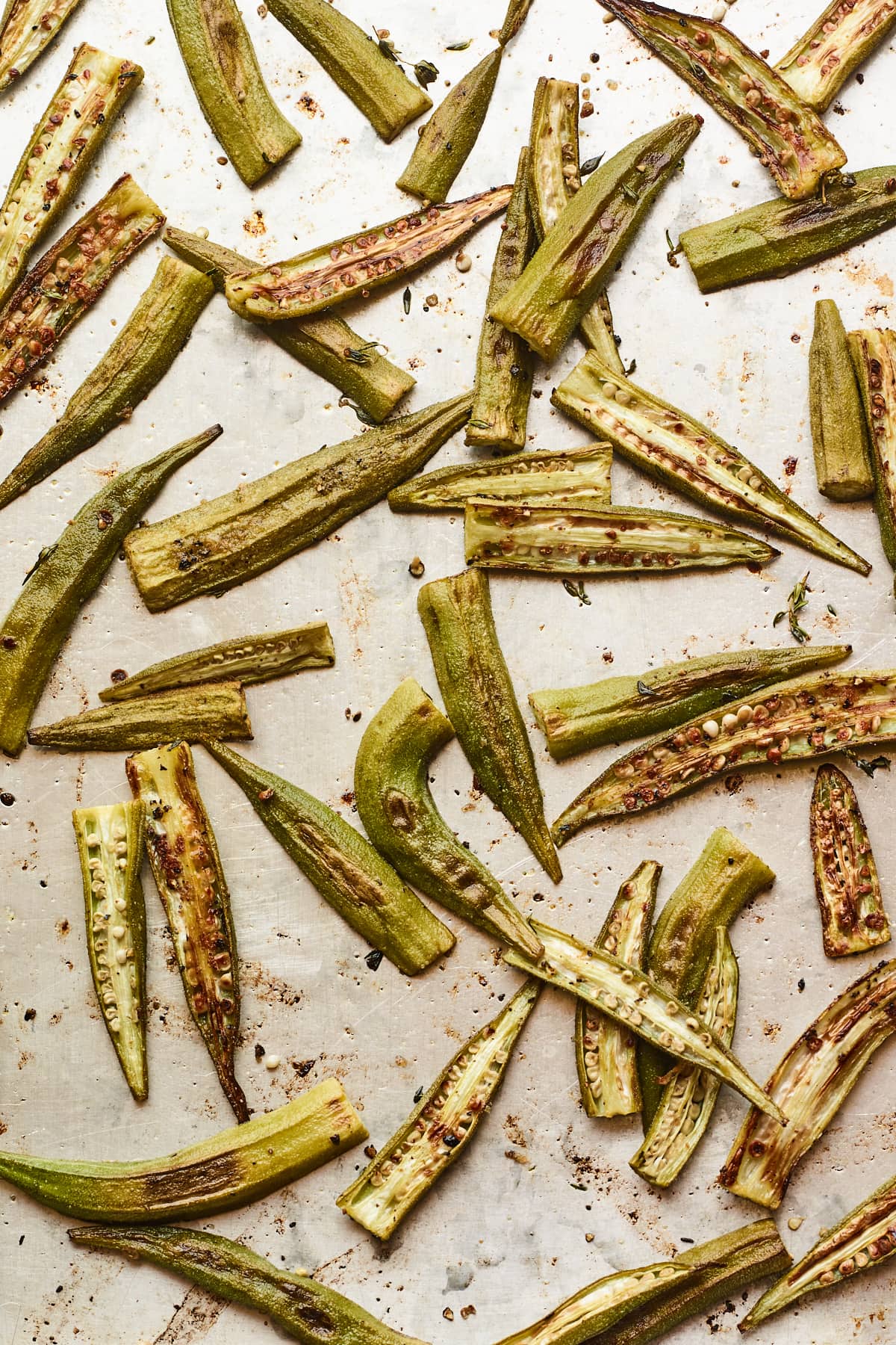 Roasted okra on a baking sheet.